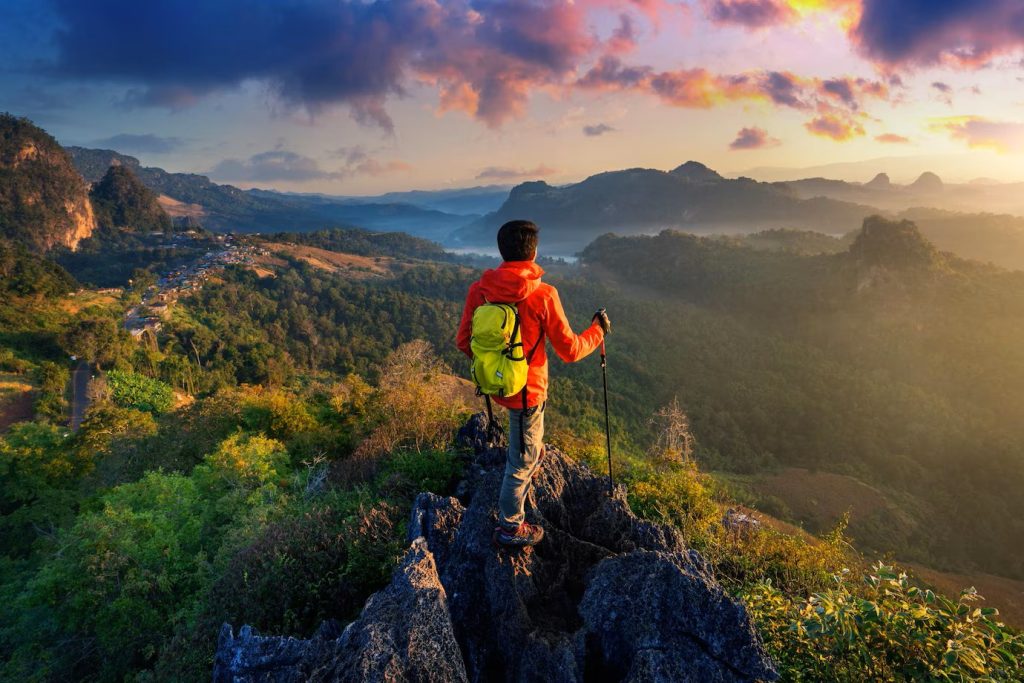 backpacker-standing-sunrise-viewpoint-ja-bo-village-mae-hong-son-province-thailand_335224-1356
